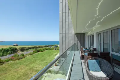 a balcony with a view of the ocean at Harbour Lights in Newquay