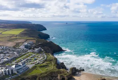 an aerial view of the ocean and a beach at Sea Folly in Perranporth