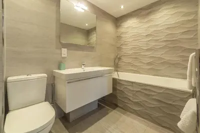 a bathroom with a toilet and a sink and a tub at Teyr Mor Cliff in St. Agnes
