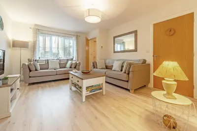 a living room with a couch and a table at The Seahouse in Portreath