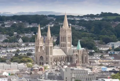 a large cathedral with a city in the background at The Threshing Barn in Gwennap