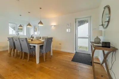 a dining room with a table and chairs at Westaway in Portreath