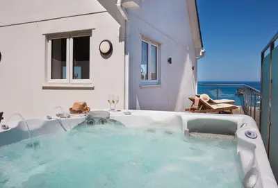 a jacuzzi tub in a room with a view at Westaway in Portreath