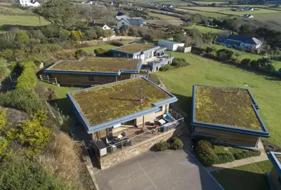 an overhead view of a house with a green roof at Triskel in St. Agnes