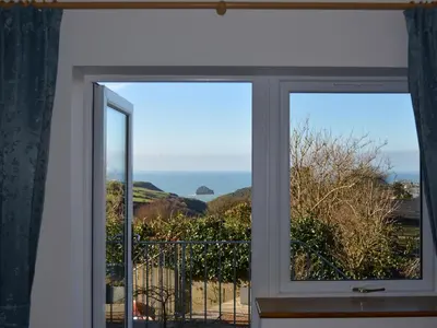 a window with a view of the ocean at Glenhaven in Tintagel