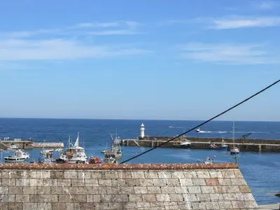 a view of a harbor with boats in the water at Polkirt Forge in Mevagissey