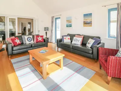 a living room with couches and a coffee table at Atlantic Reach in Bude