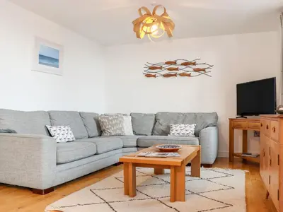 a living room with a couch and a coffee table at Ocean Blue in Penzance