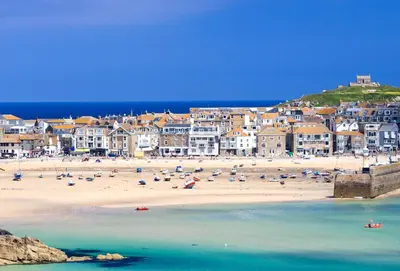 a beach with a bunch of people on it at 3 Sandy Lane in Carbis Bay