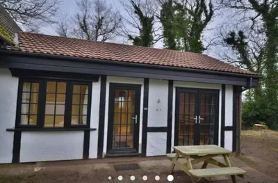 a small house with a picnic table in front of it at 41 Tudor Court in Hayle