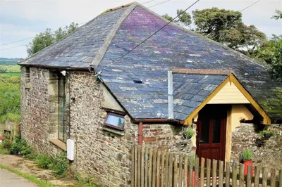 a small brick house with a roof at Cottage Barn, Jacobstow in Bude