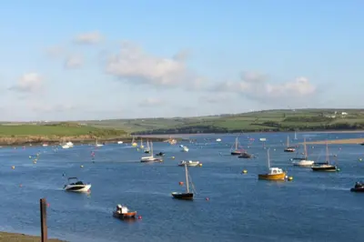 a group of boats in a large body of water at Cottage Barn, Jacobstow in Bude