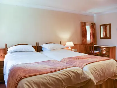 two beds sitting next to each other in a bedroom at Ricann - Ukc4244 in Lanreath