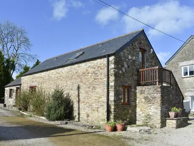 an old brick building with a balcony on it at Ricann - Ukc4244 in Lanreath