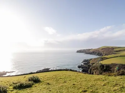 a view of the ocean from a hill at 4 Rose Cottages in Looe