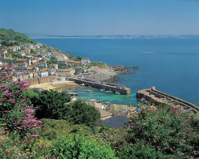a view of a town on the shore of a body of water at Tehidy Holiday Park Wigwam Camping Cabins in Illogan