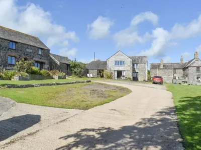an empty road in front of a house at The Owl's Roost - Uk12087 in Saint Endellion