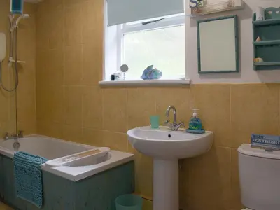 a bathroom with a sink and a tub and a toilet at Sea View - Uk30589 in Talland