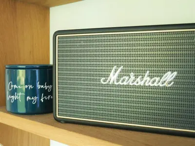 a microwave sitting on a shelf with a blue mug at The Wriggly Tin & Baa Spa at Tregoose Old Mill in Newquay