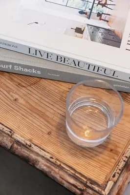 a bowl of water sitting on top of a book at Harbour View House in St Ives