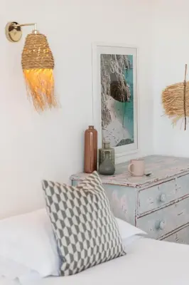 a living room with a couch and a dresser at Harbour View House in St Ives