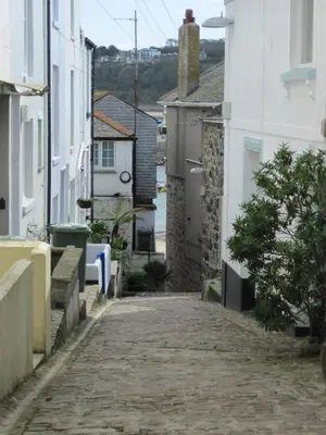 an empty street in a town with buildings at Little Pengelly Farm in Crowan