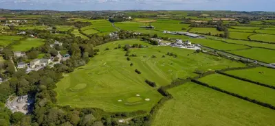 an overhead view of a green golf course at Wheal Amelia- Beautifully Fitted Wooden Lodge Helston Cornwall in Helston
