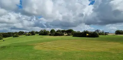 a view of a golf course with a green field at Wheal Amelia- Beautifully Fitted Wooden Lodge Helston Cornwall in Helston