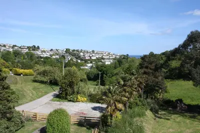 a view of a park with a city in the background at Kerryanna Country House Bed and Breakfast in Mevagissey