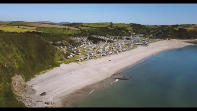 an aerial view of a beach with a bunch of boats at Lime Kiln Cottage, Pentewan, Cornwall in Pentewan