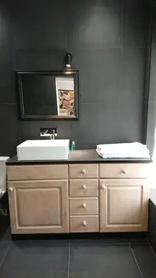 a bathroom with a sink and a mirror at The Black Palms - Fistral Beach in Newquay