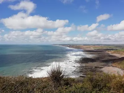 a view of the ocean from the top of a hill at Chalet 26 Widemouth Bay in Bude