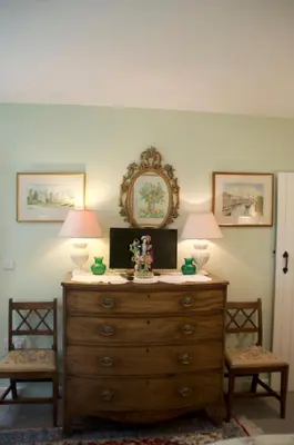 a wooden dresser with two lamps on top of it at The Old Deer House in Bodmin
