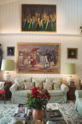 a living room with two couches and a painting on the wall at The Old Deer House in Bodmin