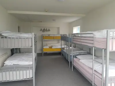 a room with four bunk beds in a dorm room at Blue Room Hostel Newquay in Newquay