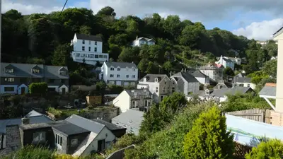 a town on a hill with houses at Commanders Cabin 'As seen in Beyond Paradise' in Looe