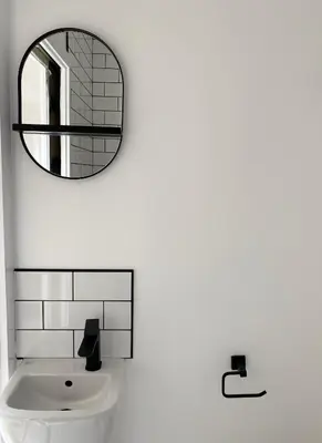 a bathroom with a mirror and a sink at Seaporth Studio St Ives in St Ives