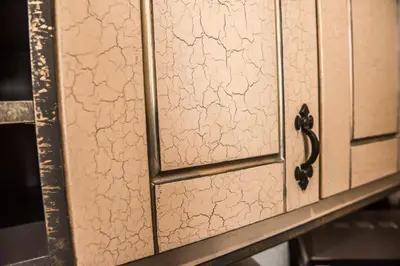 a close up of a wooden cabinet with a door at Deluxe Pirate's Cove Themed Apartment in St Austell