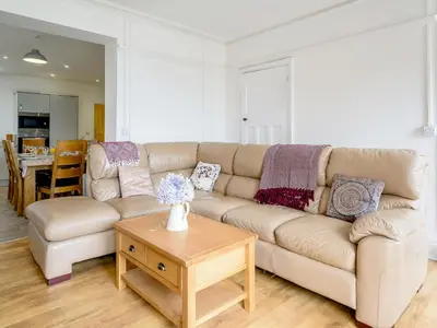a living room with a couch and a table at Beachside, West Yardley House - Uk31200 in Downderry