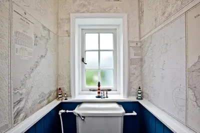 a bathroom with a white toilet and a window at Cregoes, Mylor - Bungalow - Riverview - Free Parking & WiFi - Pet friendly in Flushing