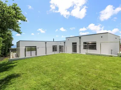 a large white building with a large yard at Atlantic View in Penzance