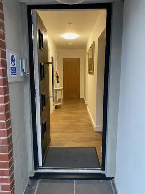 a hallway with a door leading to a hallway with a hallwayngthngthngthngth at Toppesfield House B&B in Bude