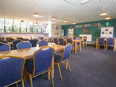 a classroom with tables and chairs in a classroom at 32 Trevithick in Hayle