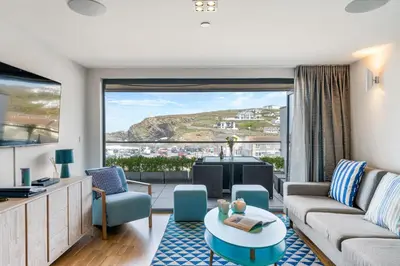 a living room with a couch and a table at SeaEsta in Portreath