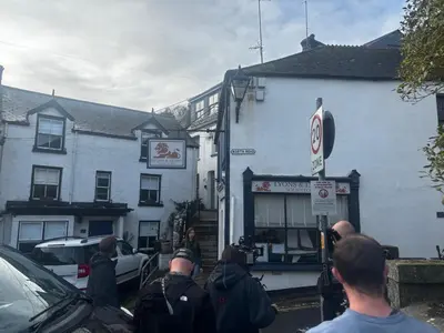 a group of people standing outside of a building at On Season 4 of BBC 1s BEYOND PARADISE - Prospect House is TWO PRIVATE APARTMENTS in this 17th CENTURY COTTAGE - Apartment 2 has a KIDS CABIN BUNK ROOM - Book both apartments for ONE LARGE HOUSE with Connecting Door In Lobby - FREE PUBLIC PARKING OUTSIDE in Looe