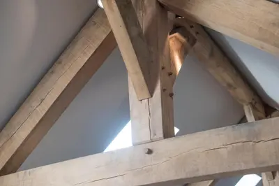 a close up of the wooden beams of a roof at Wella 5 Star Gold Award Luxury Cottage in St Ives