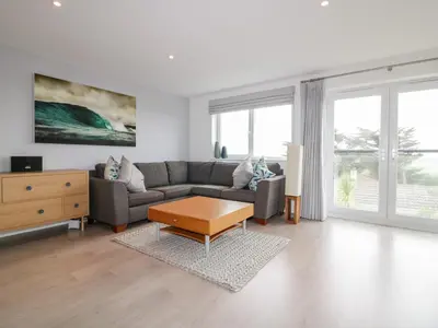 a living room with a couch and a coffee table at The Lookout in Newquay