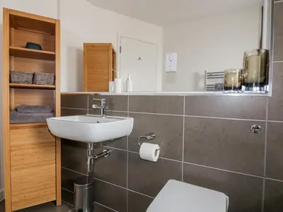 a bathroom with a sink and a toilet at The Lookout in Newquay