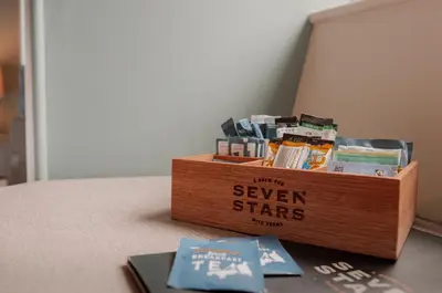 a wooden box with a sign that says seven stars at Seven Stars Penryn in Penryn
