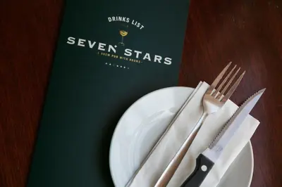 a book with a plate and a fork and knife at Seven Stars Penryn in Penryn